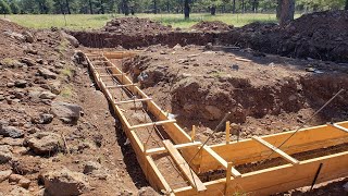 DIY Concrete Forms Forming the foundation footings [upl. by Novar524]