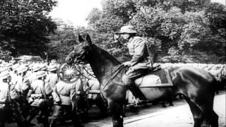 German troops decorated and troops pass in review along Avenue Foch Paris durinHD Stock Footage [upl. by Naugan103]